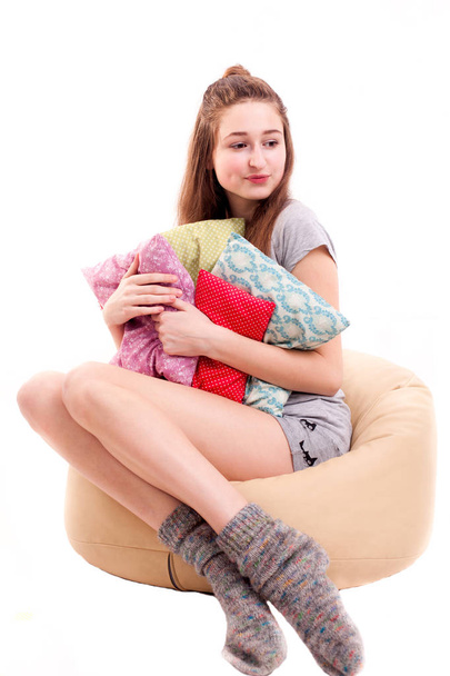 Girl go to sleep with a lot of pillows isolated - Φωτογραφία, εικόνα