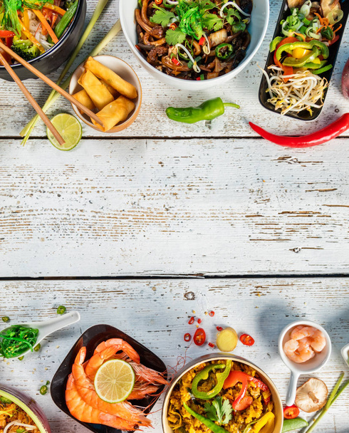 Asian food served on wooden table, top view, space for text - Fotoğraf, Görsel