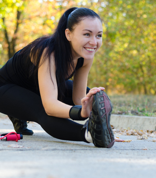 Happy woman exercising in a park - Φωτογραφία, εικόνα
