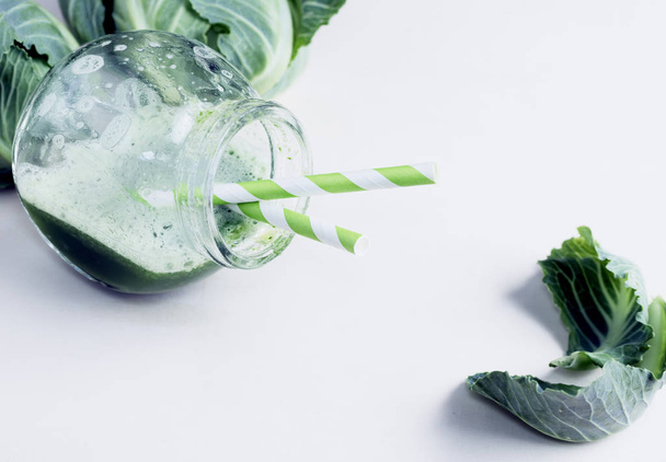 Green healthy cabbage detox drink on white - Photo, Image