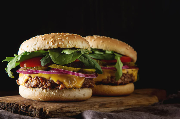 Fast food. Vegetarian burger with a chop, cucumber, tomato and l - Zdjęcie, obraz