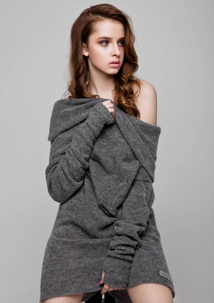 Young beautiful fashion model wearing knitwear  - Фото, зображення