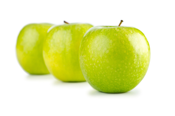 Manzanas verdes aisladas sobre el fondo blanco
 - Foto, imagen