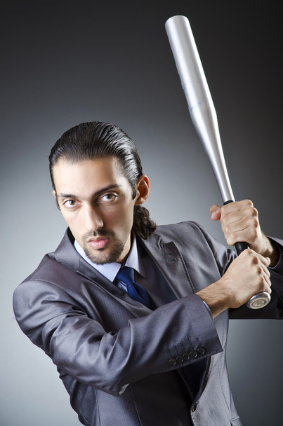 Angry businessman with bat on white - Фото, зображення