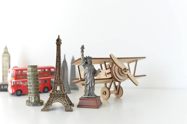 Travel and tourism concept with souvenirs from around the world. - Фото, изображение