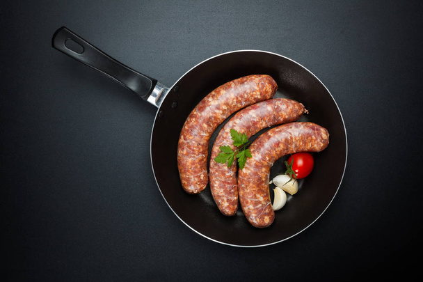 Pork sausages in frying pan - Photo, Image