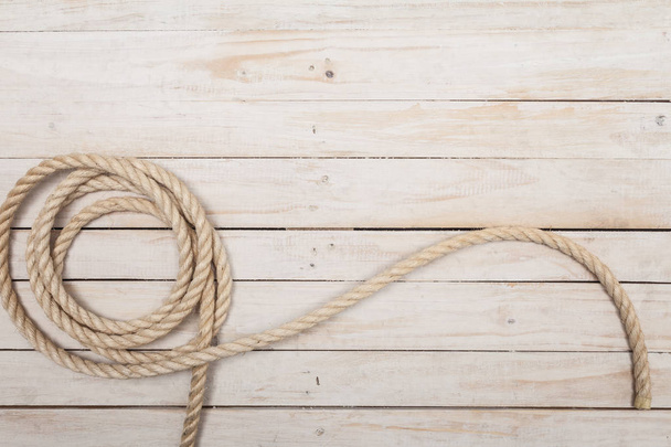 Rope on wooden background - Foto, imagen