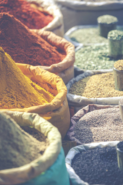Colorful spices powders and herbs in traditional street market i - Photo, Image