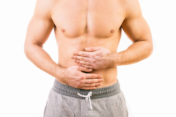 Man with stomach pain over white background - Zdjęcie, obraz