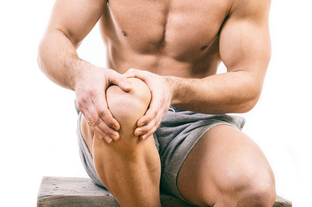 Man with knee pain over white background - Zdjęcie, obraz