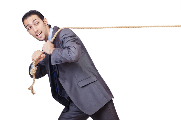 Empresario tirando de la cuerda en blanco
 - Foto, Imagen