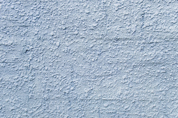 Embossed stucco grayish-bluish surface closeup. - Photo, Image
