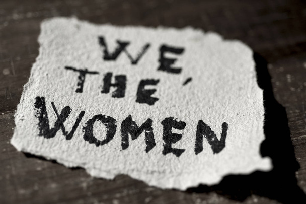 text we the women in a piece of paper - Photo, Image