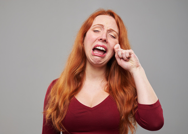 Lonely redhead woman crying  - Photo, image