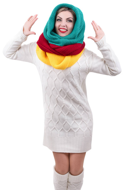 A young woman in a bright knitted scarves.Colored scarves. - Фото, изображение