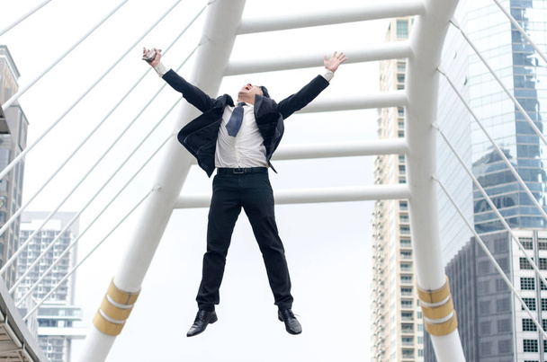 Success concept. Asian businessman jumping with happy moment.  - Photo, Image