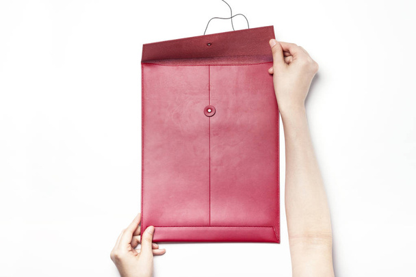 holding A red leather envelope  - Zdjęcie, obraz