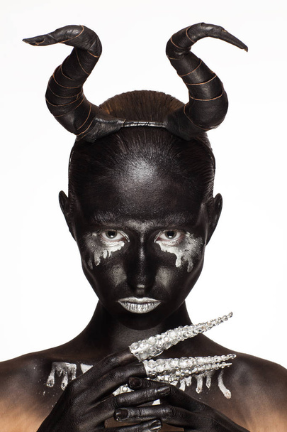 girl with horns on his head - Фото, зображення