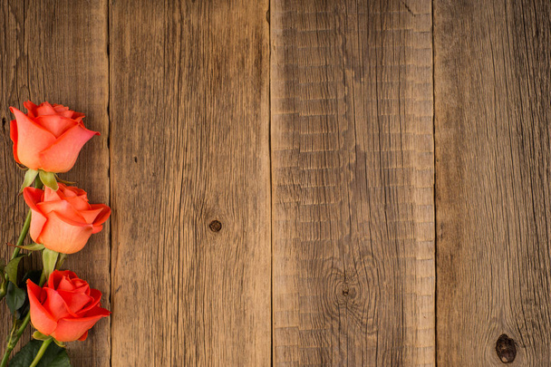 Roses on the old wooden table. - Fotografie, Obrázek