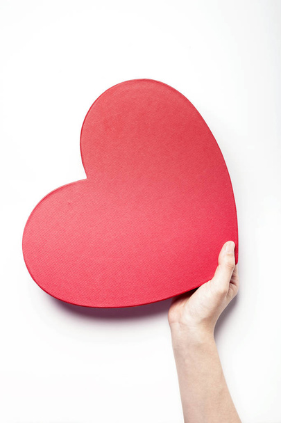 holding a heart box - Foto, Imagen