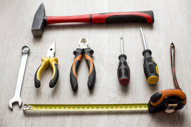 Grunge old home tools wrench on wood floor background - Fotó, kép