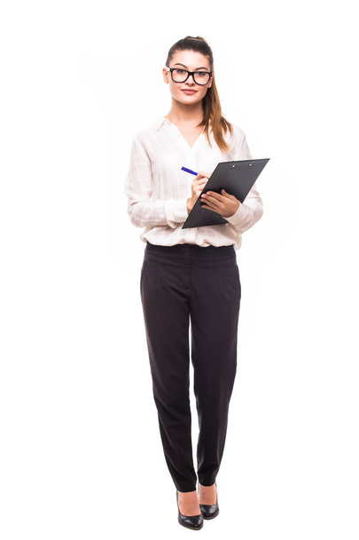 Beautiful business woman make notes on her clipboard isolated - Foto, Imagen