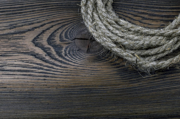 Dark wooden background texture with old rope - Φωτογραφία, εικόνα