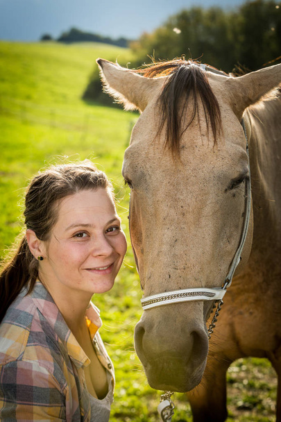 Portrait of a girl with a brown horse in Slovakia - Photo, image