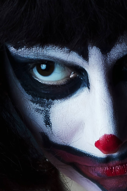 sad clown mask on woman face - Fotó, kép