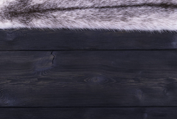 The white fur mink on a black wooden background texture - Valokuva, kuva