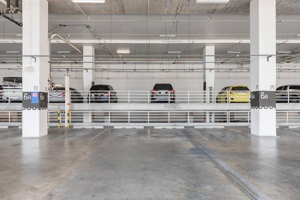 interior of parking garage with car and vacant parking lot - Photo, Image