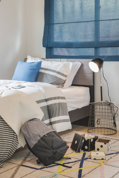 blue pillow on single bed in modern bedroom - Фото, зображення