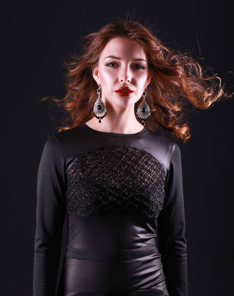 Portrait of beautiful brunette woman in black dress - Fotografie, Obrázek