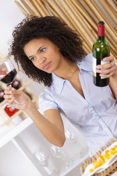 young woman tasting wine in cellar - Valokuva, kuva