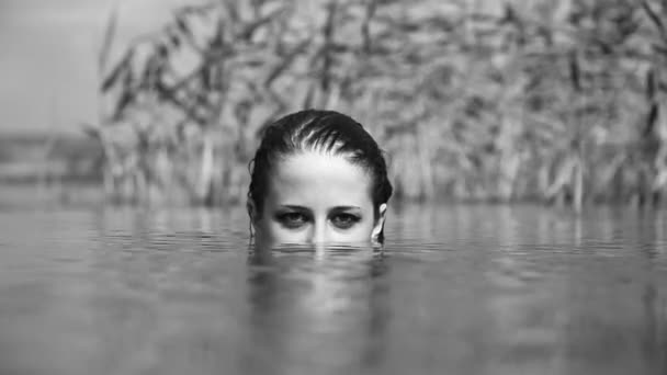 Girl in the river. Video in noisy black and white style - Footage, Video