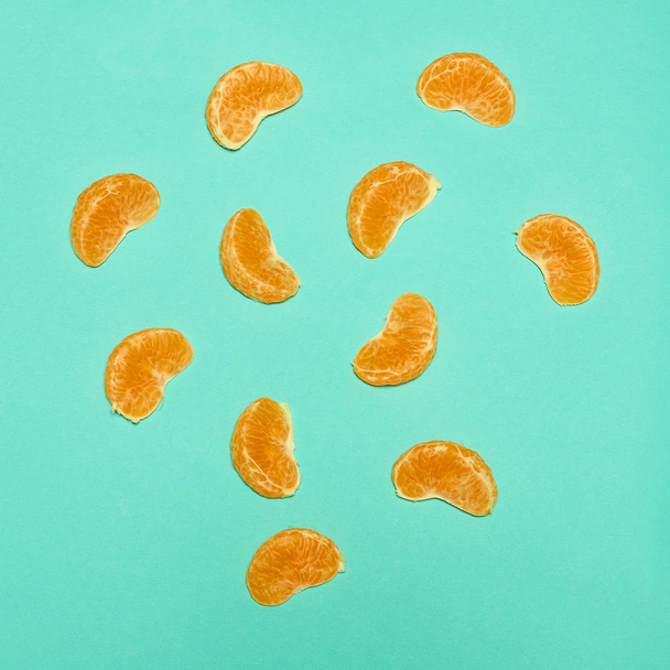 Ripe Mandarin fruit peeled open - 写真・画像
