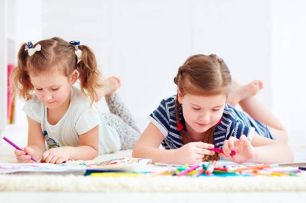 happy young girls, kids painting with felt pen together - Valokuva, kuva