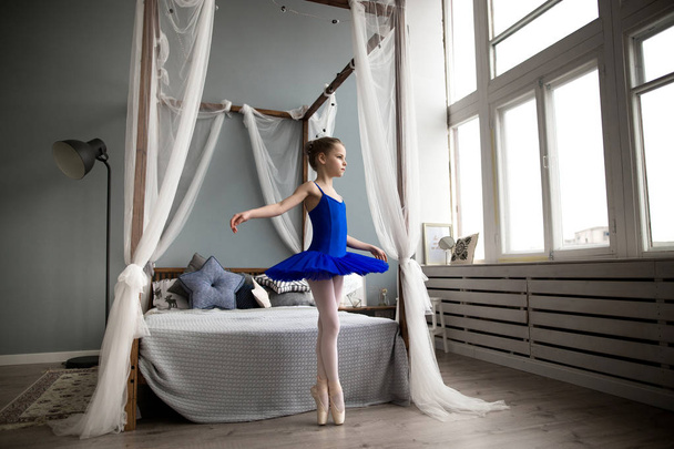 Little ballerina sitting - Фото, зображення