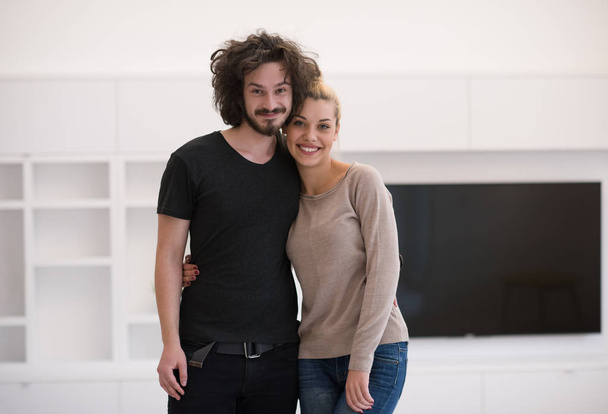 couple hugging in their new home - Foto, immagini