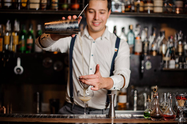 smiling bartender is making coctail - Foto, Imagem
