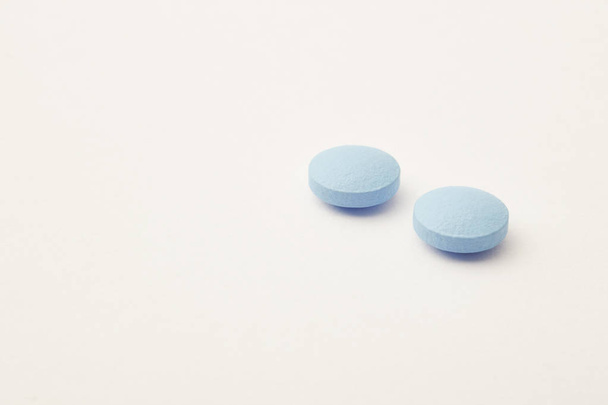 Pills over a beige background. Medicament treatment. Health care - Zdjęcie, obraz