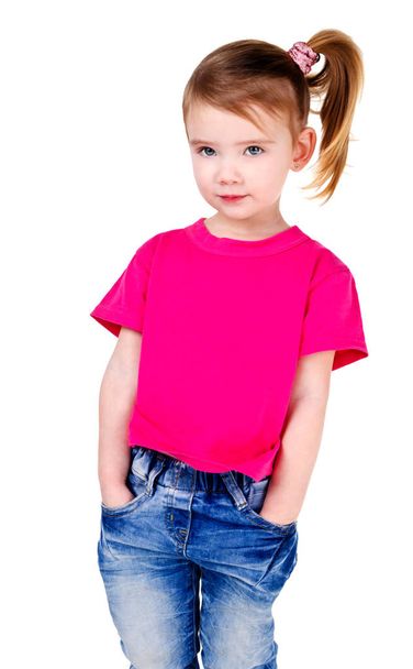 Portrait of  smiling cute little girl in jeans  - Fotó, kép
