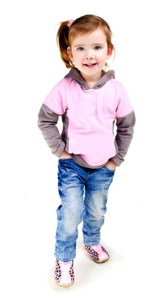 Portrait of  smiling cute little girl in jeans - Zdjęcie, obraz