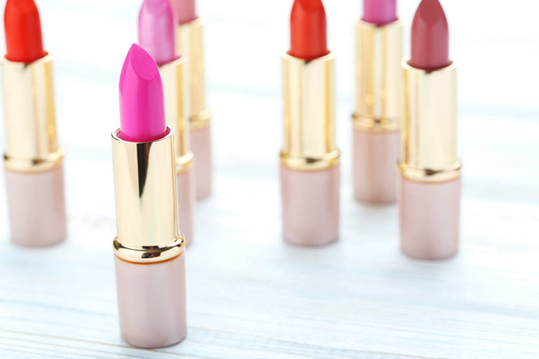 Colorful lipsticks on table - Фото, изображение