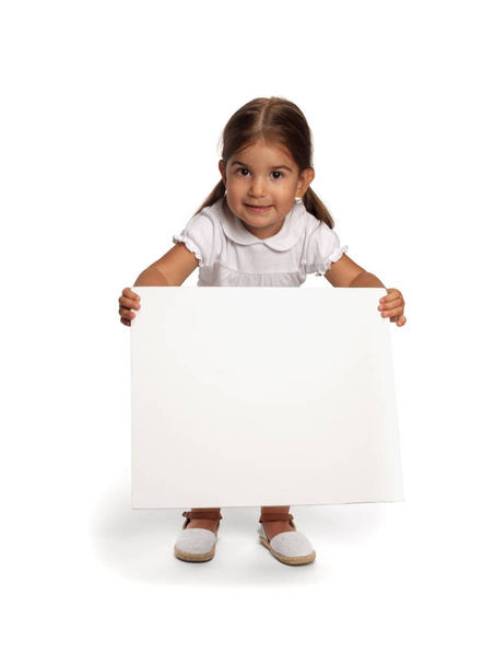 cute little girl with blank placard - Foto, immagini