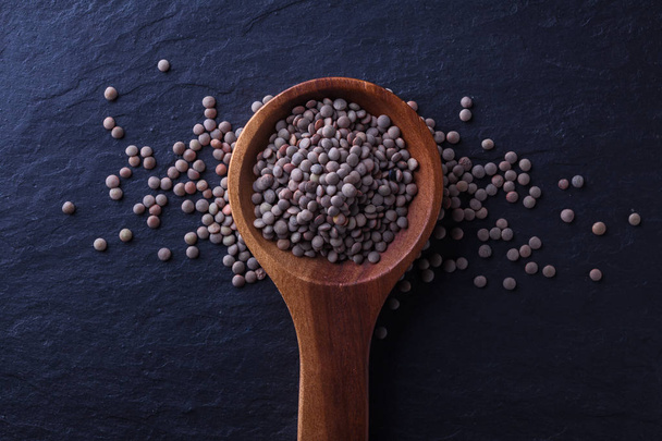 Wood spoon with lentils - Photo, image