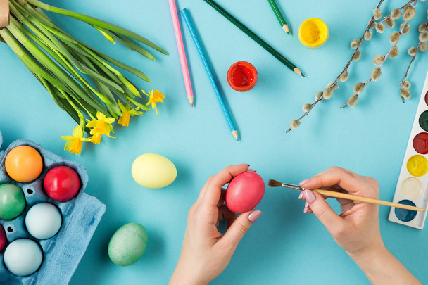 The top view of easter on blue table office workplace - 写真・画像