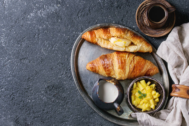 Breakfast with croissant and mango fruit - Valokuva, kuva