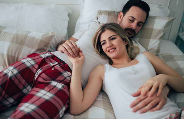 couple lying in bed  - Photo, Image