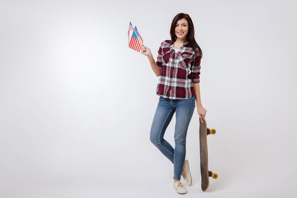 Active young woman representing American nation in the studio - Foto, afbeelding